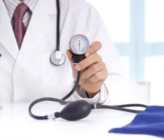 Doctor holding sphygmomanometer