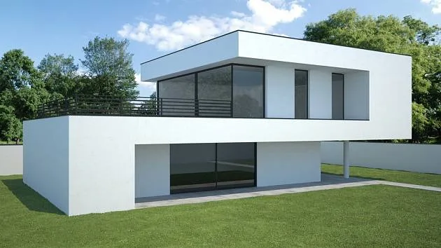 Modern dům s plochou střechou v zeleném prostředí.
